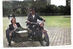 Isaac and Rachel ride the streets of cobblestone streets of central Sofia in the 1930s